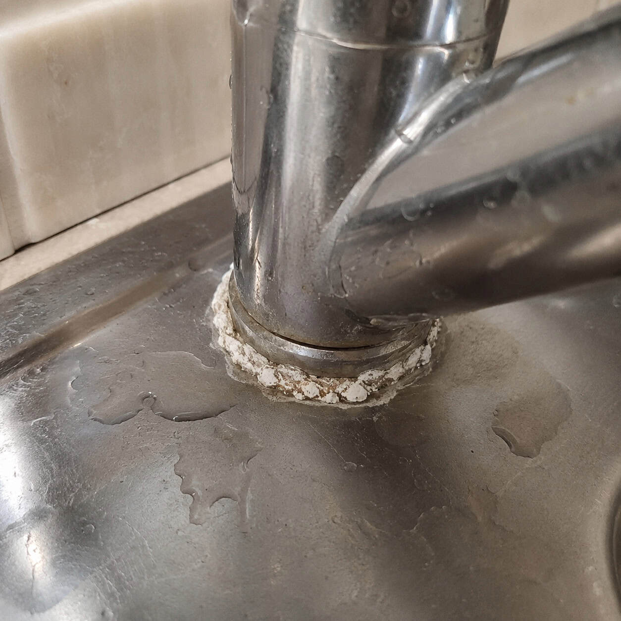The Crusty Ring Around the Faucet Base