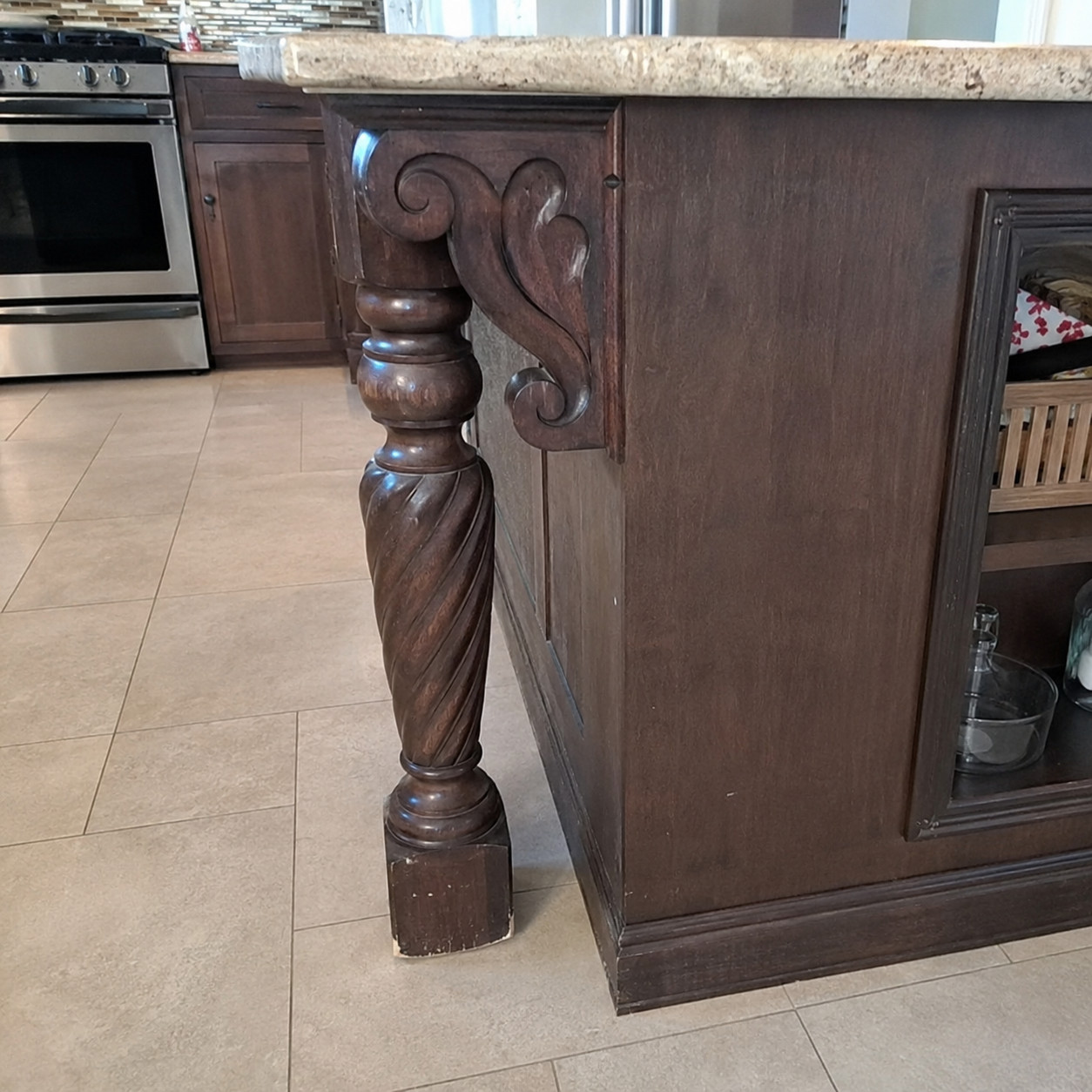 Carved corbels and curlicue island legs
