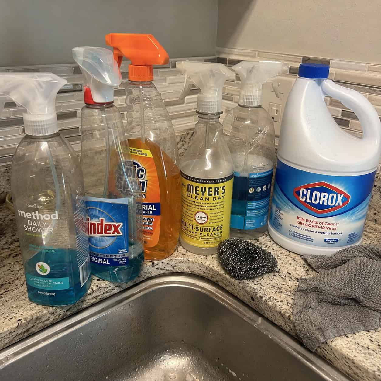 Cleaning Products Lined Up on the Edge