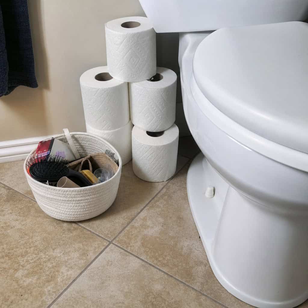 Toilet Paper and Clutter Stored on the Floor
