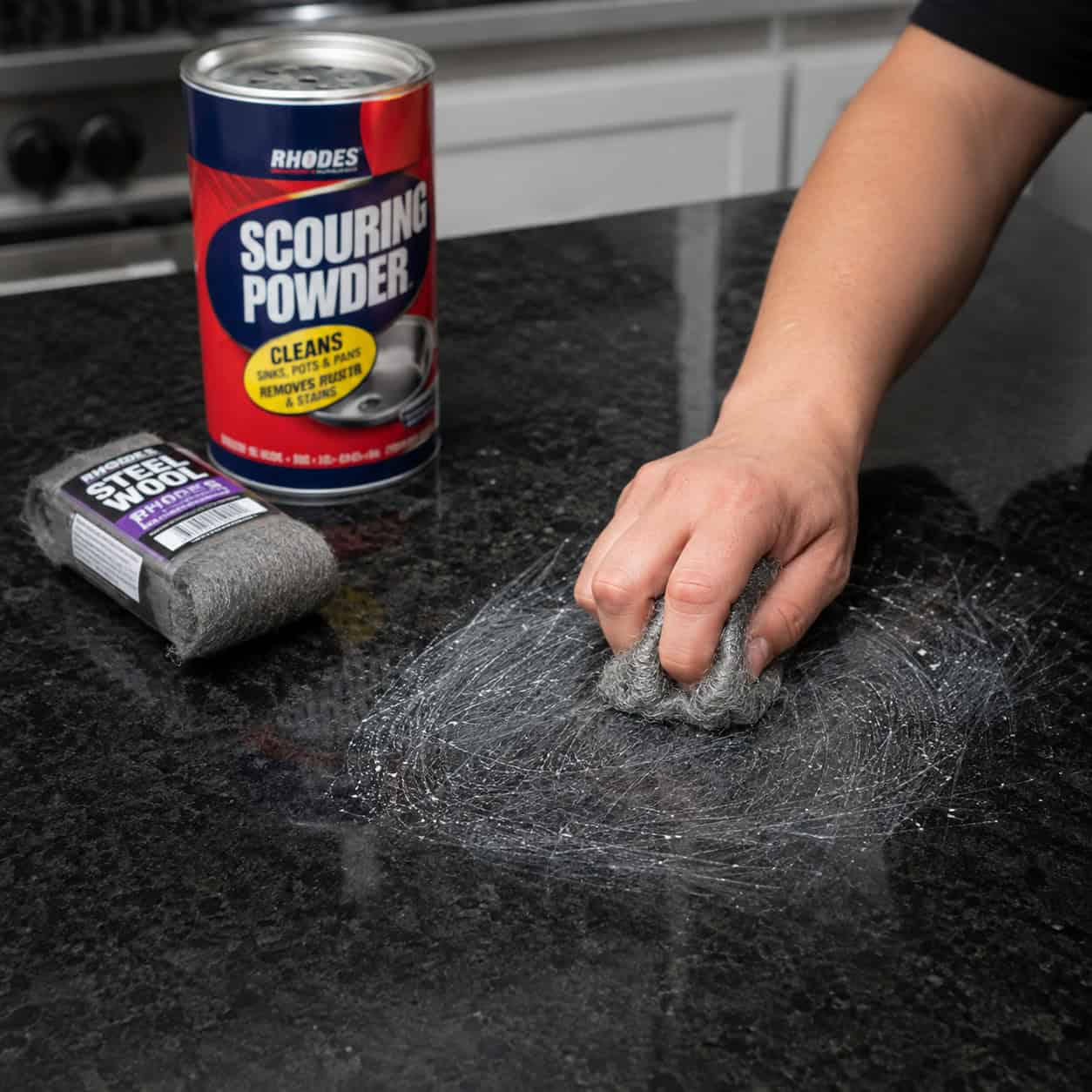 Scrubbing with steel wool and scouring powder