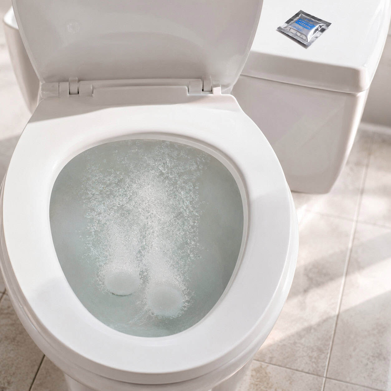 A Denture Tablet Dropped in the Toilet Bowl