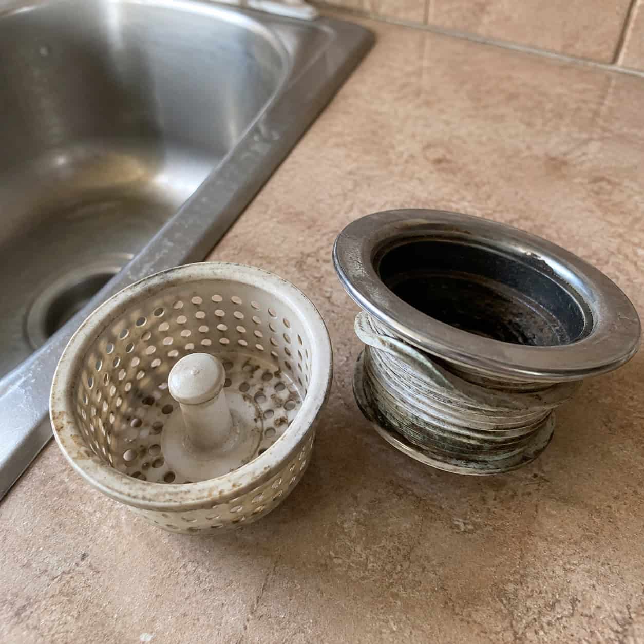 A flimsy plastic sink strainer