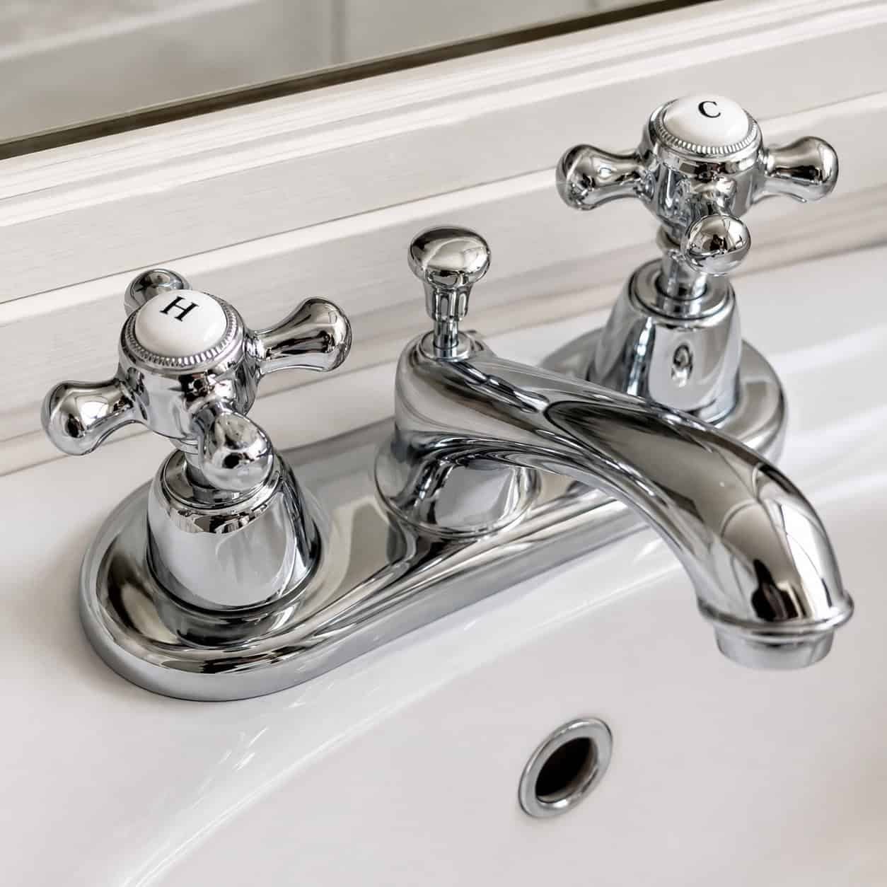 Cross-Handle Faucets with Porcelain Hot/Cold Buttons