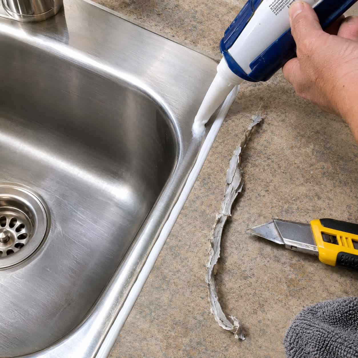 Cut Out and Re-Caulk the Sink and Countertop Seams
