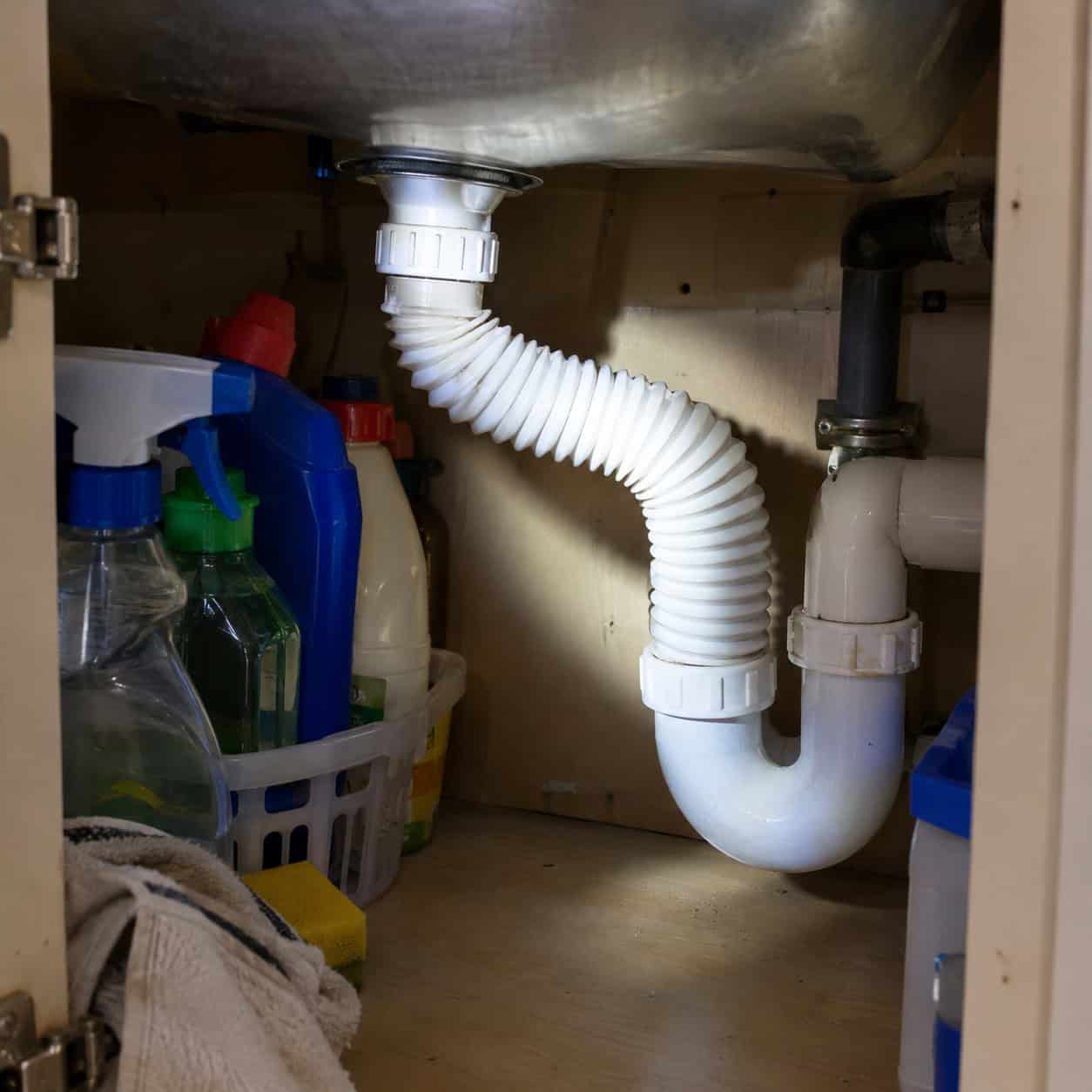 The accordion drain pipe under the sink