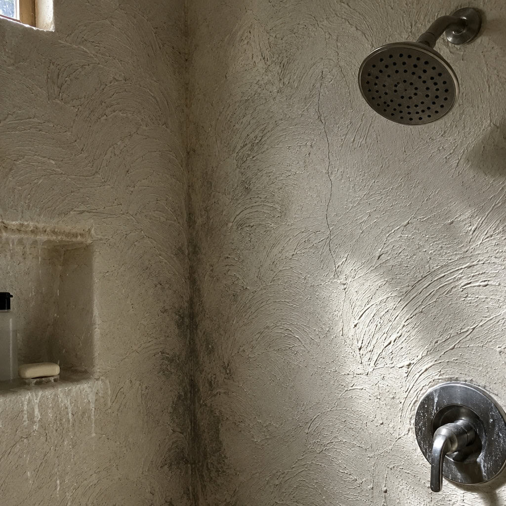 Swirl-Textured Faux-Adobe Shower Walls
