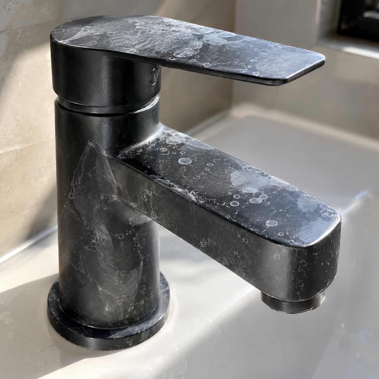 Matte Black Fixtures in a Hard-Water House