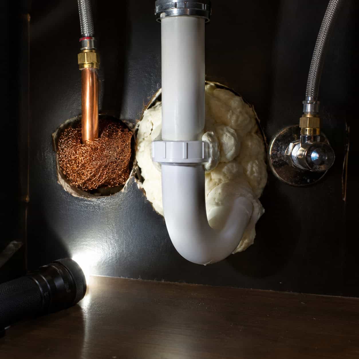 Seal the Pipe Holes Under the Sink