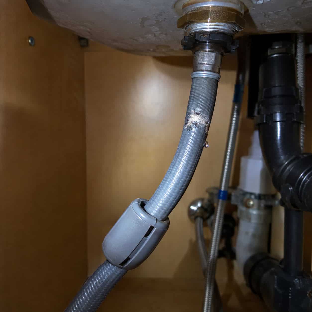 The Pull-Down Sprayer on a Plastic Hose and Clip