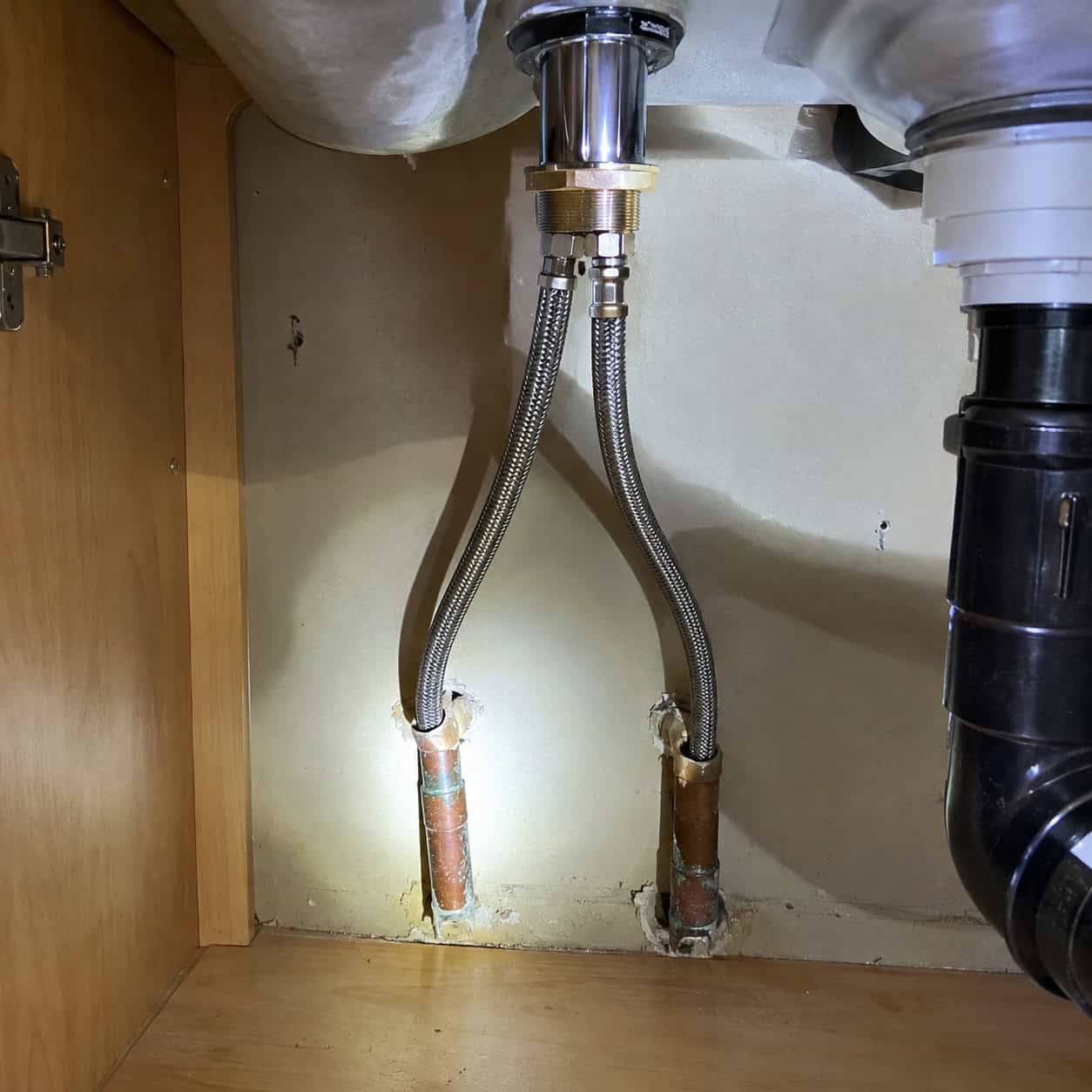 No shutoff valves under the sink