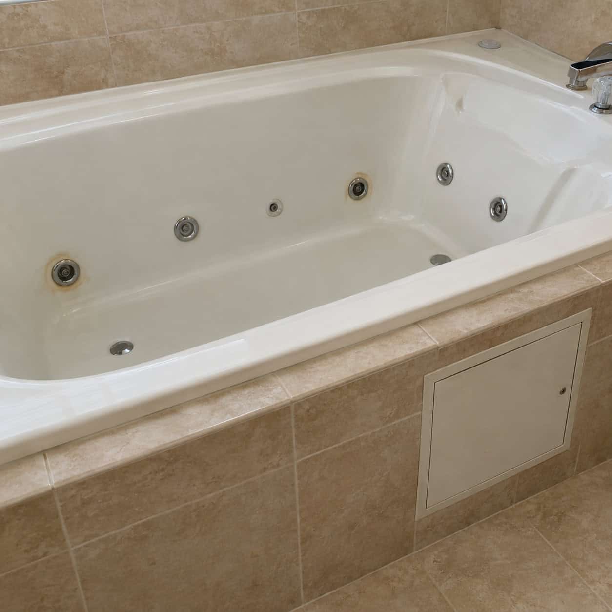A jetted whirlpool tub
