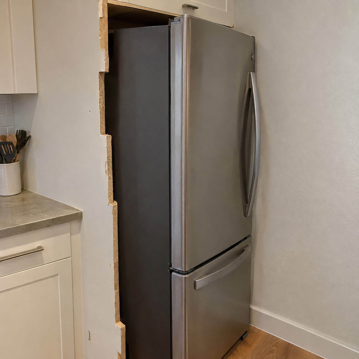 A fridge jammed into a too-small opening