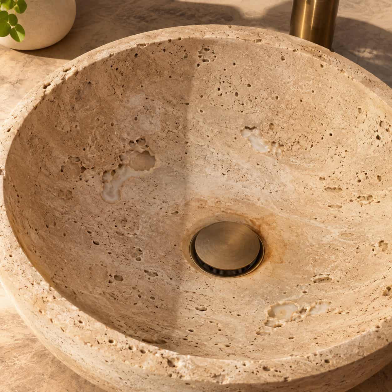 A Travertine or Onyx Stone Basin