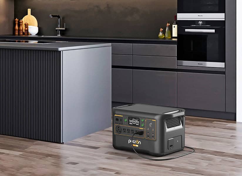 Pecron F3000LFP portable power station on a kitchen floor beside the island